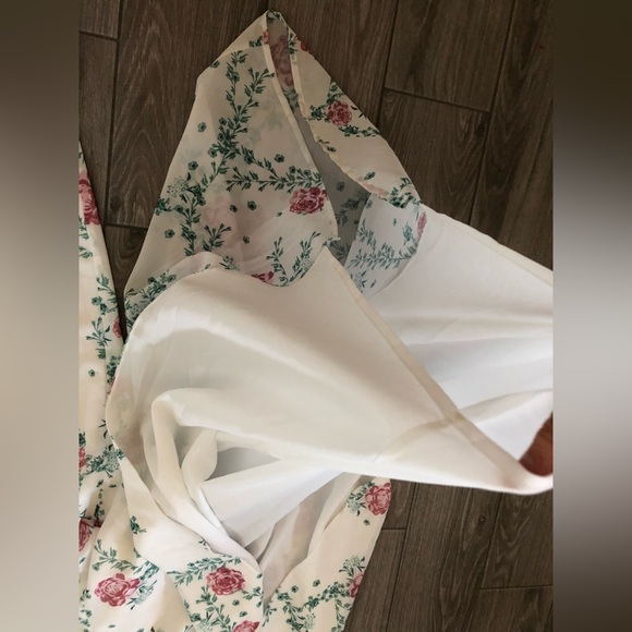 Eloquii|White chiffon floral halter jumpsuit with wide leg, open leg detail•••22 - Picture 11 of 17